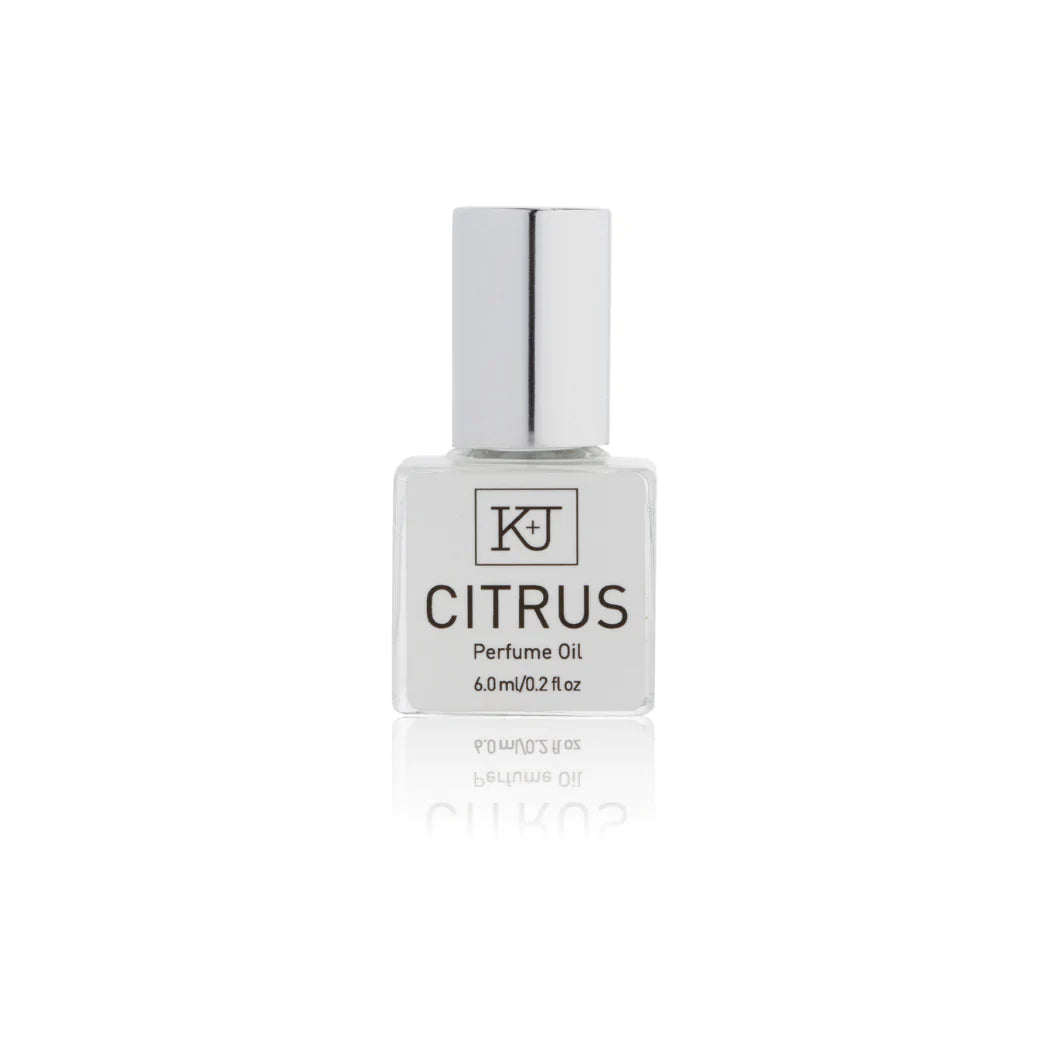 Kelly & Jones "CITRUS" perfume bottle: small, clear, square bottle with a long chrome lid top. Text reads "CITRUS Perfume Oil 6.0ml/0.2 fl oz"