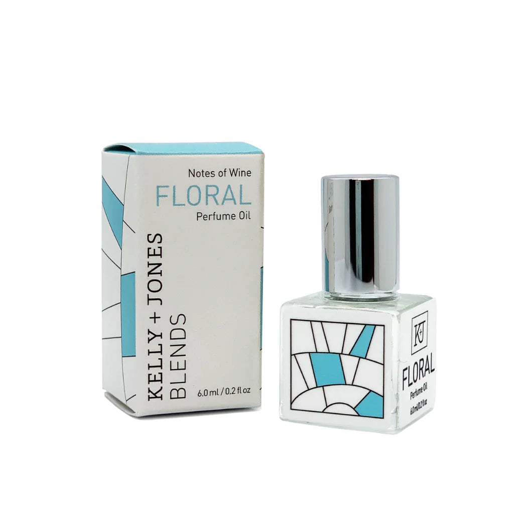 Kelly & Jones "FLORAL" perfume bottle: small, clear, square bottle with a long chrome lid top. Text reads "FLORAL Perfume Oil 6.0ml/0.2 fl oz", comes with small box.