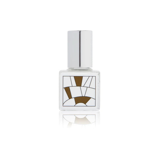 Kelly & Jones "OAK" perfume bottle: small, clear, square bottle with a long chrome lid top. Minimalistic design graphic with brown shapes.