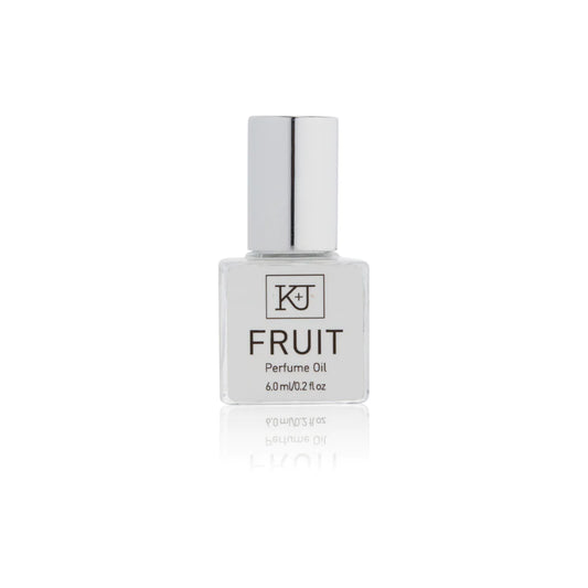 Kelly & Jones "FRUIT" perfume bottle: small, clear, square bottle with a long chrome lid top. Text reads "FRUIT Perfume Oil 6.0ml/0.2 fl oz"
