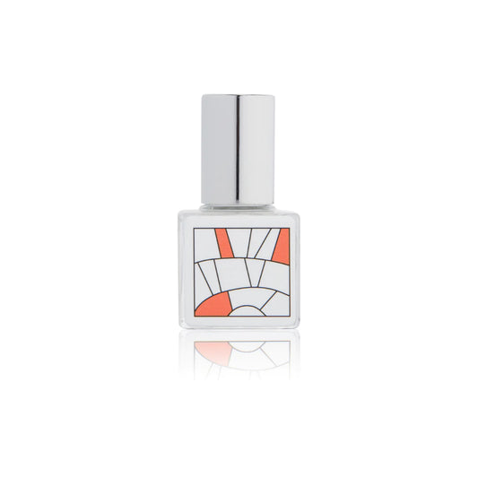 Kelly & Jones "FRUIT" perfume bottle: small, clear, square bottle with a long chrome lid top. Minimalistic design graphic with orange/red.