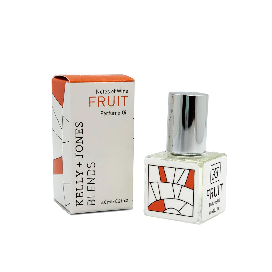 Kelly & Jones "FRUIT" perfume bottle: small, clear, square bottle with a long chrome lid top. Text reads "FRUIT Perfume Oil 6.0ml/0.2 fl oz", comes with small box.